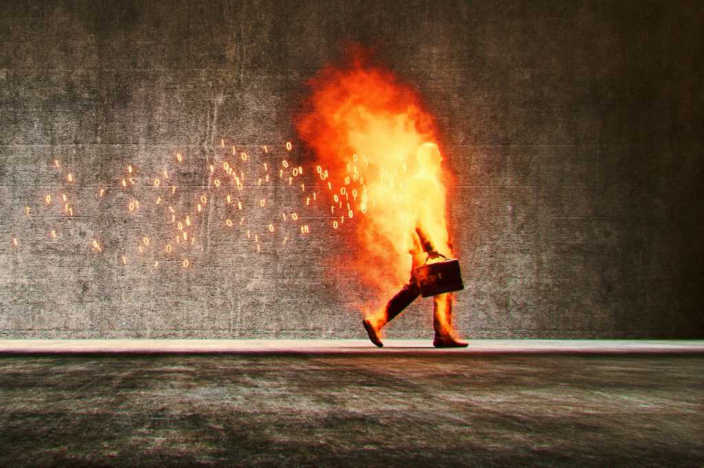 A businessman calmly walks with his briefcase while being consumed by binary flames.