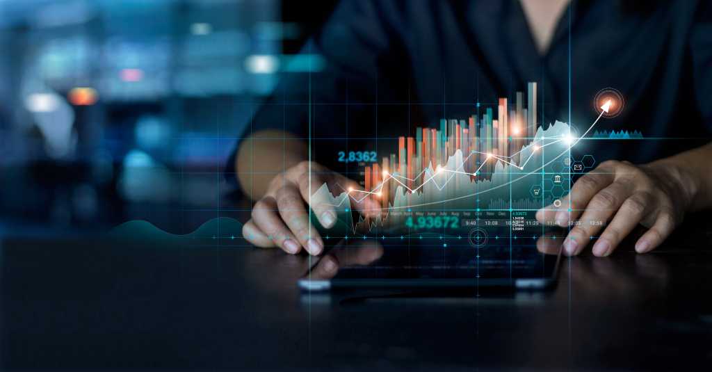 Businessman using tablet analyzing sales data and economic growth graph chart. Business planning and strategy. Analysing trading of exchange. Financial and banking. Technology digital marketing.