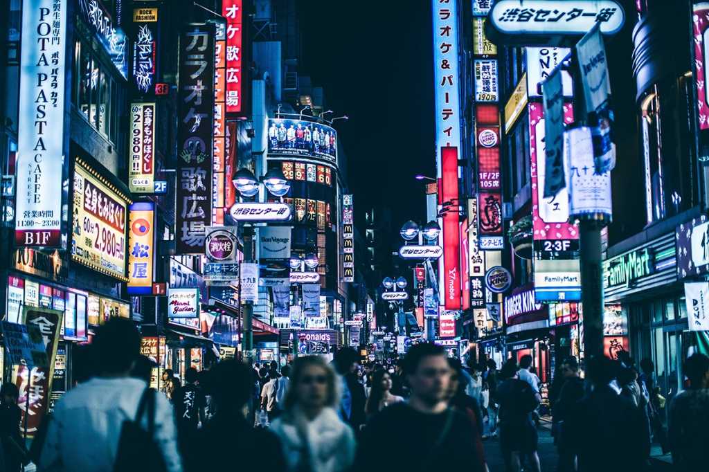 Shibuya, Japan / city / urban / street signage / pedestrians / crowd