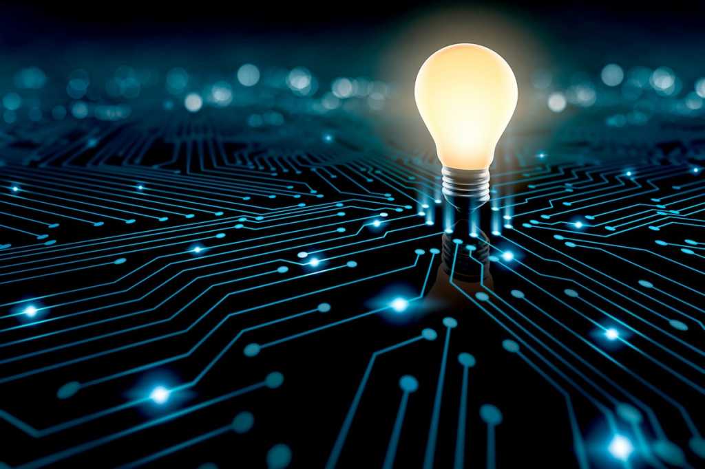 lighbulb processor on a glowing circuit board [ideas / innovation / transformation]
