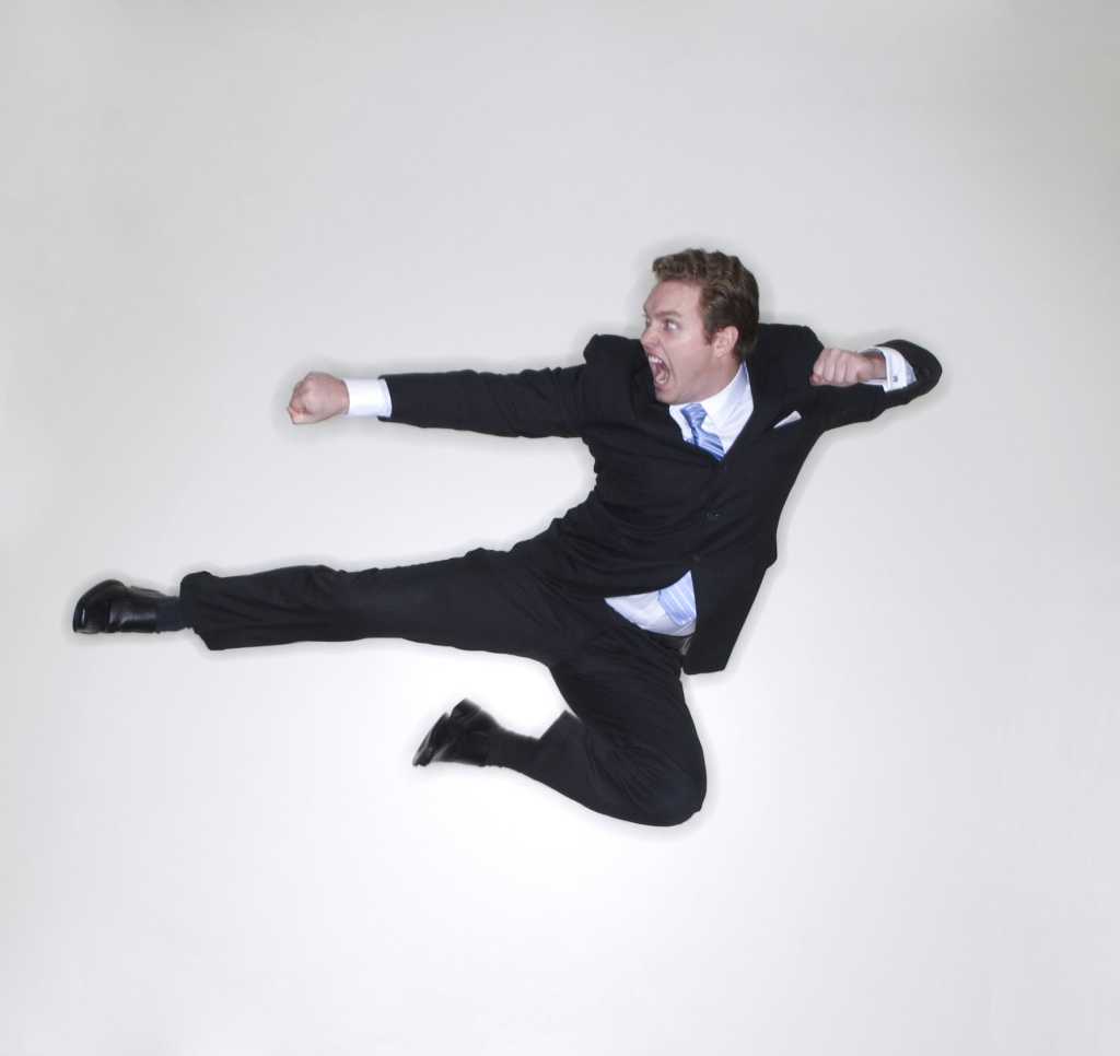 Man doing karate kick in action showing agility