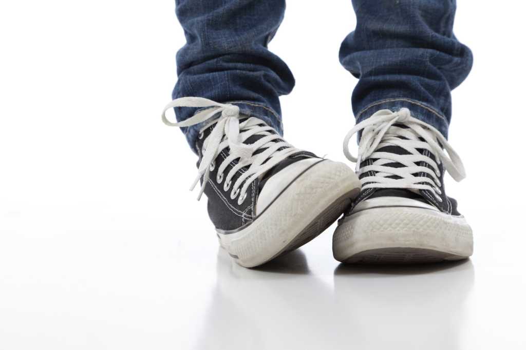 closeup of sneakers shoes showing shyness or bashful introvert