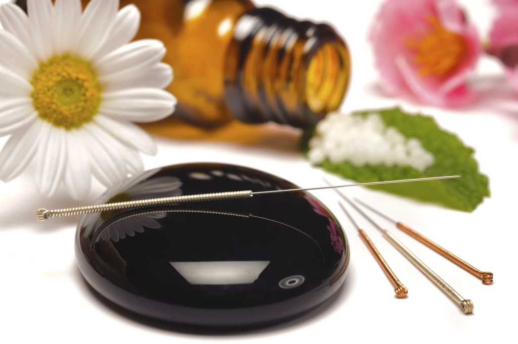 accupuncture needles with herbs