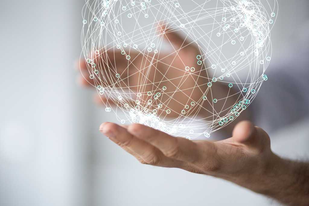 hands holding connectivity ball with white background