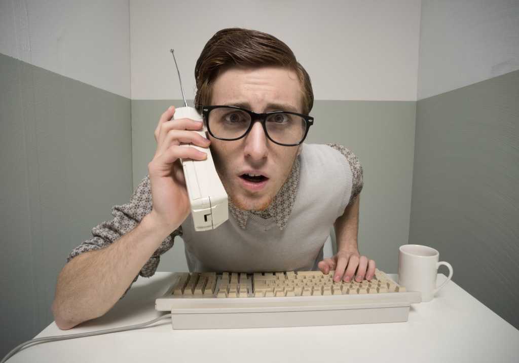 geek on retro cell phone