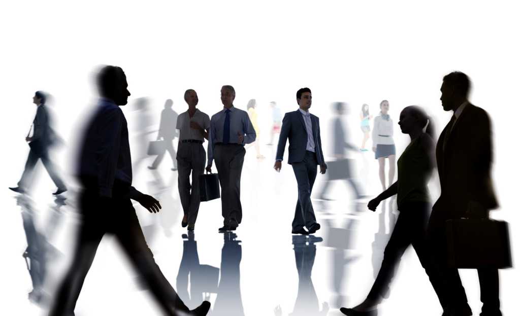 busy group of business people walking in silhouette