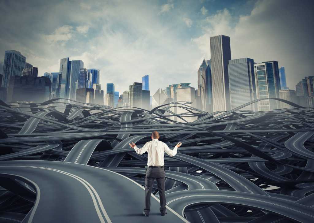 Man balancing on chaotic roadway