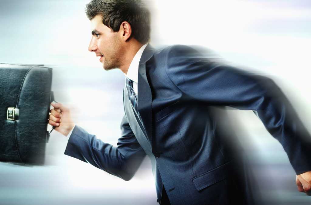 blurred man running with briefcase