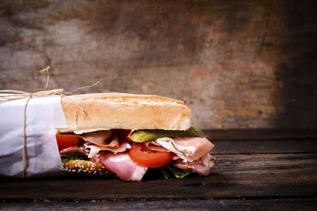 Submarine sandwich on rustic background