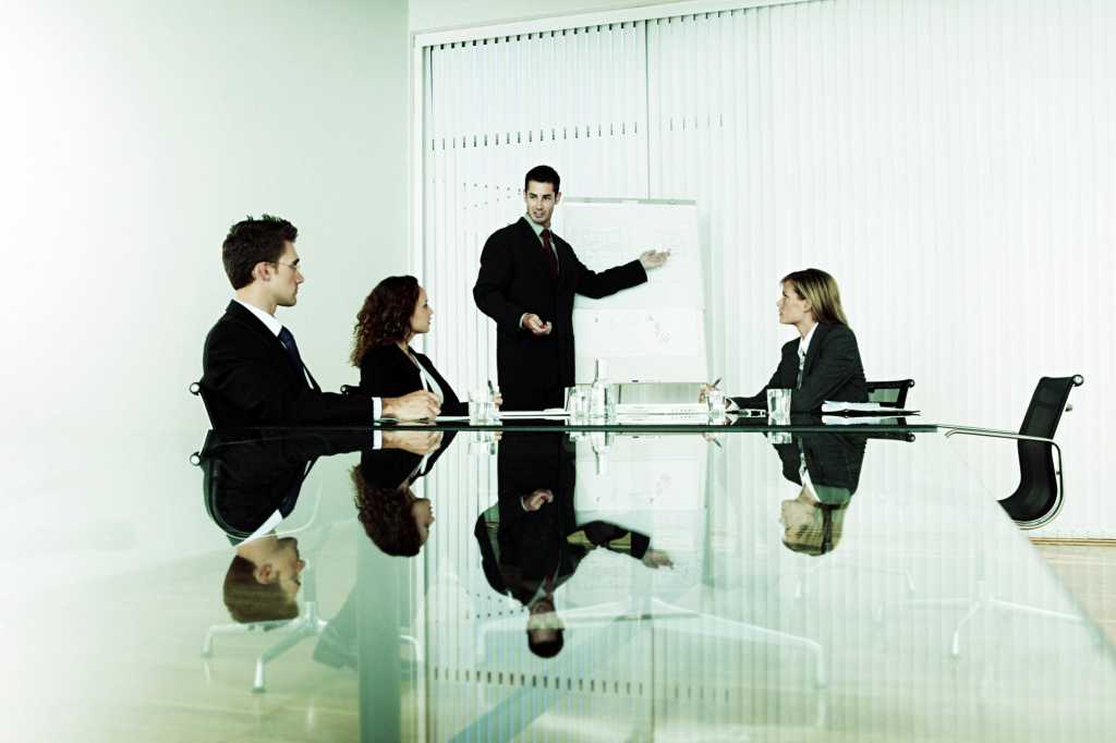 young executive standing at white board in conference room