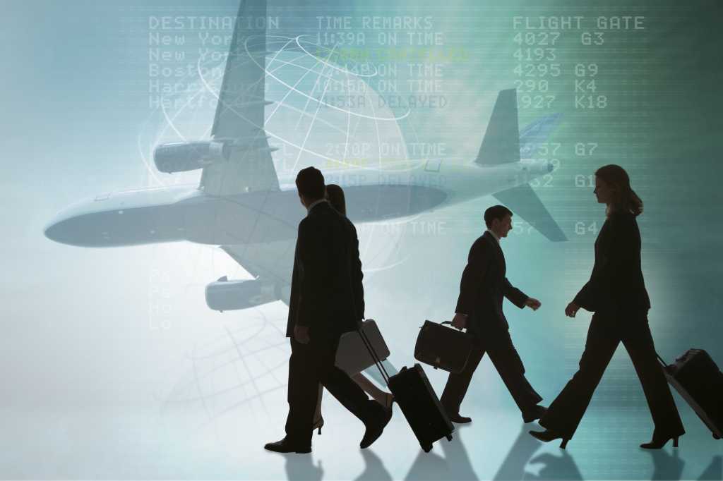 People walking with airplane in background