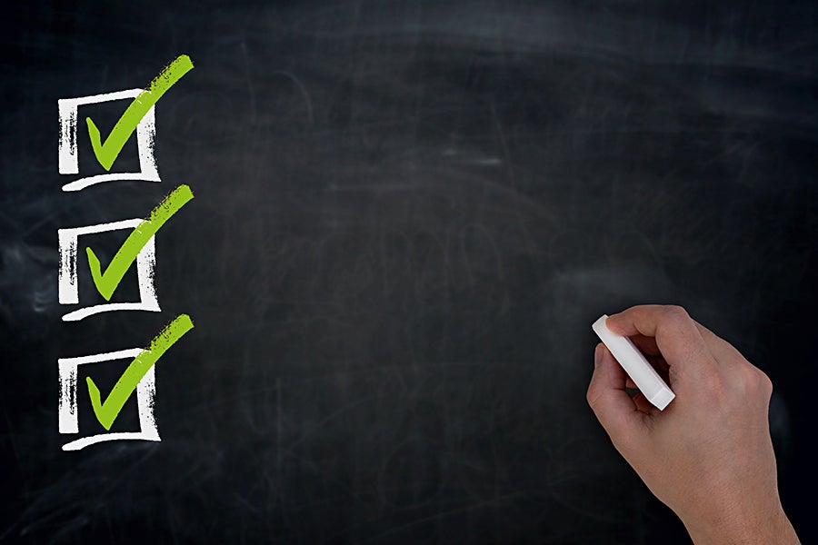 three check marks blackboard list