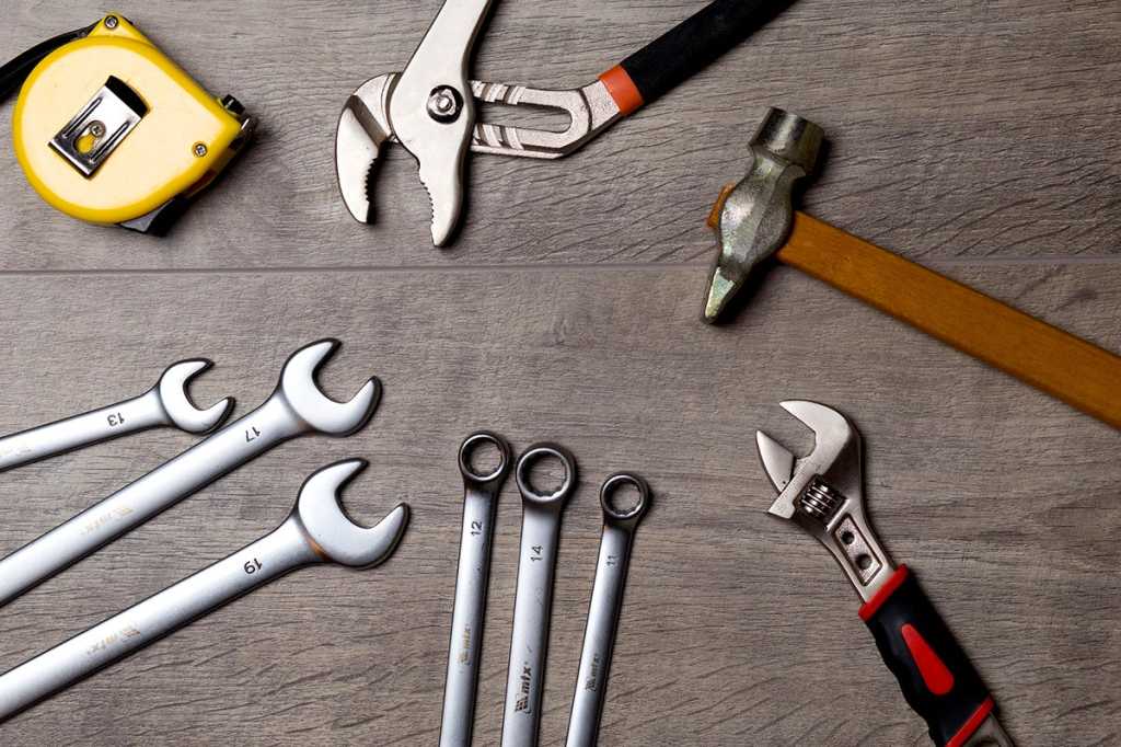 tools toolkit wrenches spanners hammer measuring tape by falconp4 cc0 via pixabay