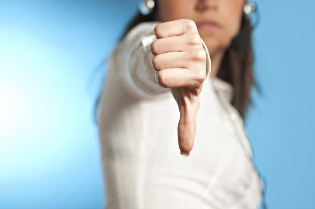 unhappy businesswoman thumbs down