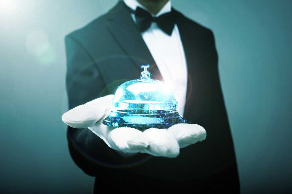 A white-gloved hand extended holding a virtual service bell.