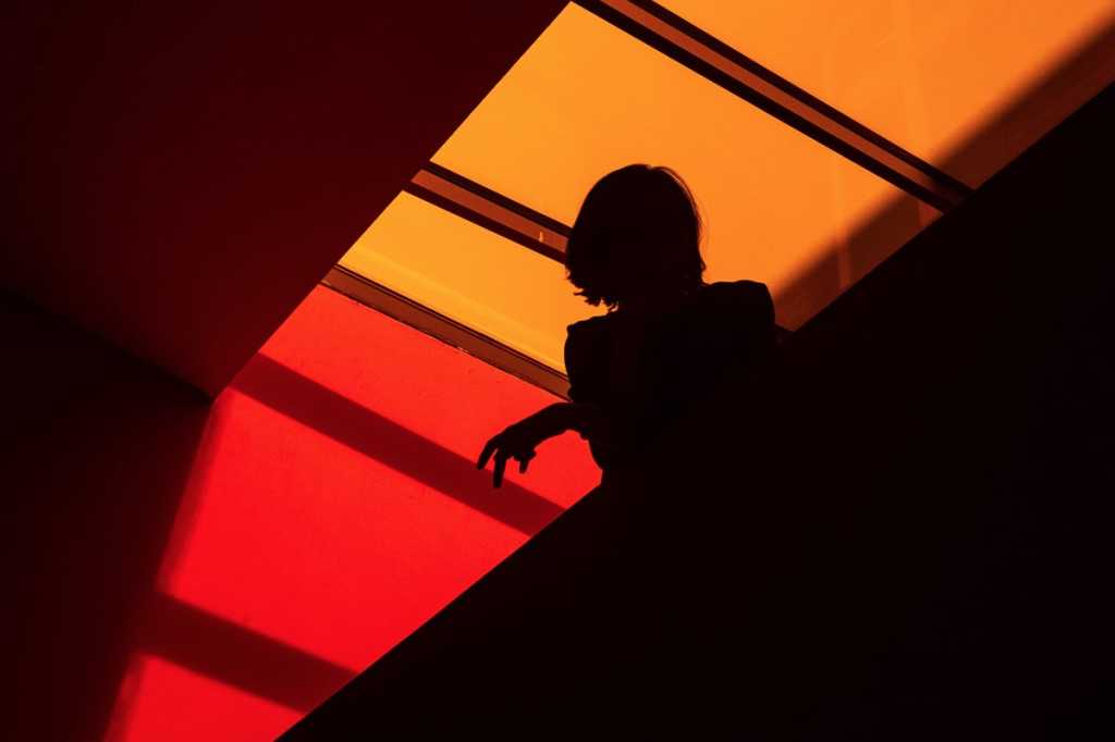 woman in shadow gender equality leader reflection business executive by artem gavrysh unsplash