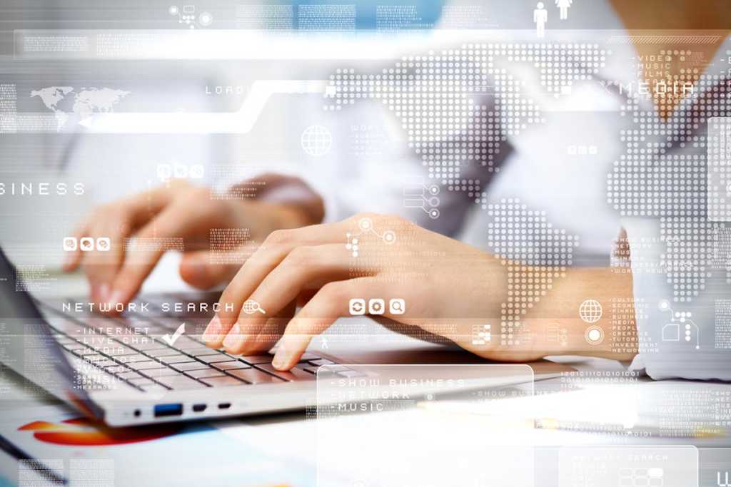 woman on computer with tech background