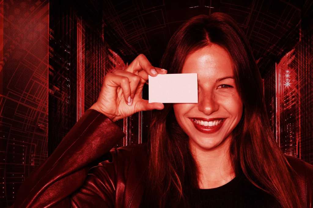 woman with business card smiling confident servers data center job search talent getty images