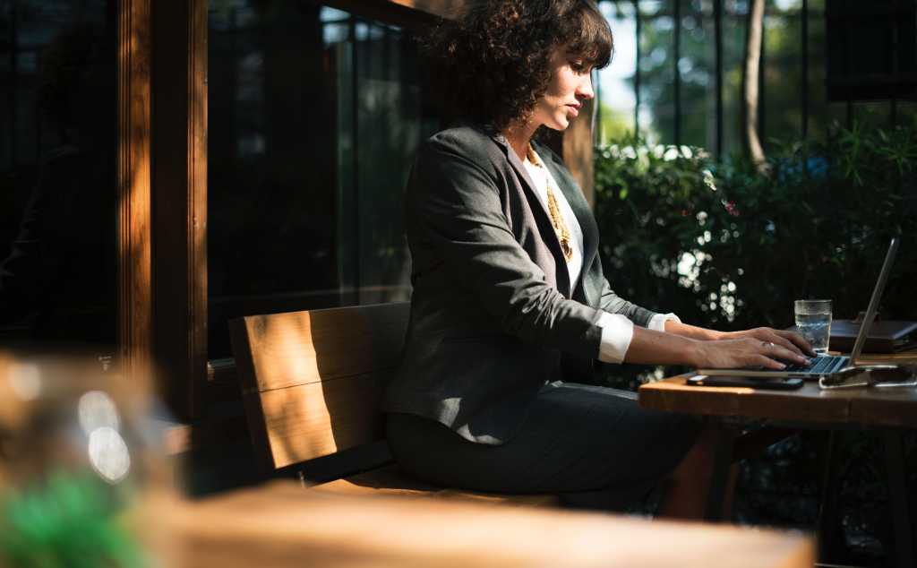 woman working on laptop - bokeh [by Rawpixel - CC0 via Unsplash]
