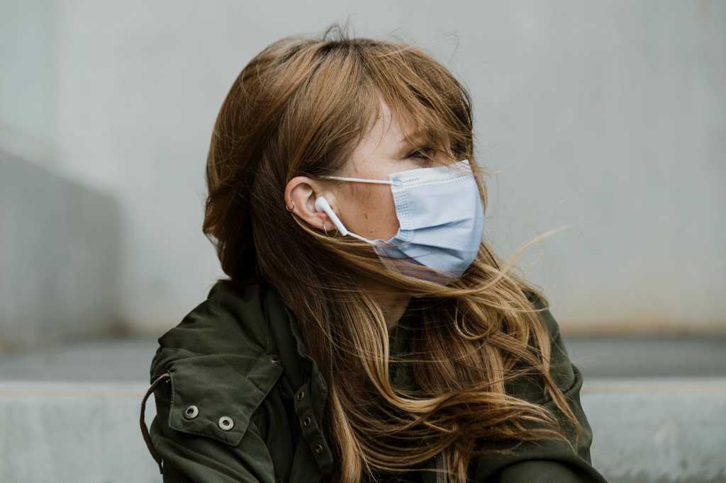 Image of a woman wearing a face mask > Healthcare safety measures / outbreak / epidemic / pandemic