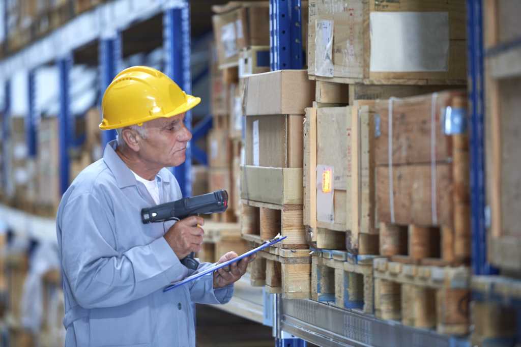 worker scanning inventory in warehouse