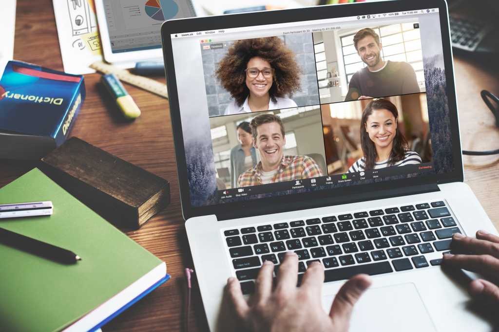 Zoom video conferencing  >  One user connected via laptop showing a grid of remote participants.