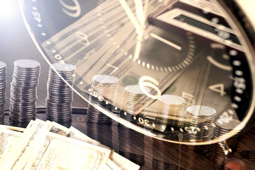 multiple-exposure image of dollars, coins, a clock, and a calculator