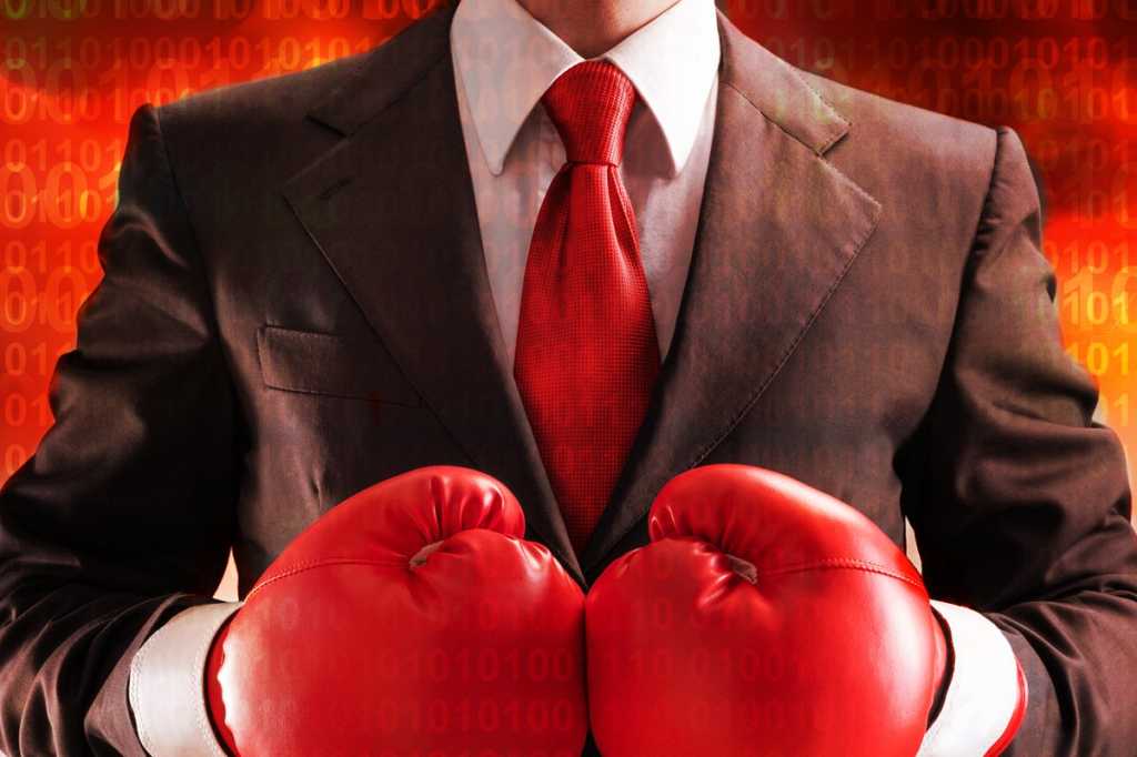 fighting back against digital disruption boxing gloves red executive in red tie thinkstock