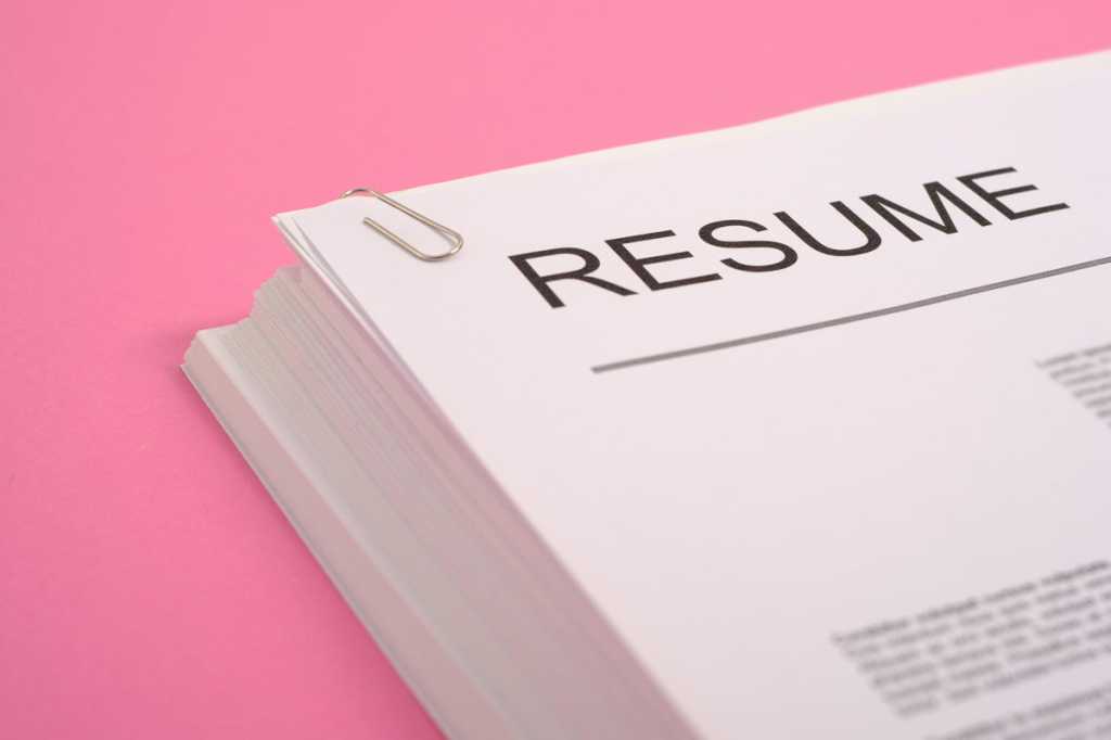 resume pink background cv job interview stack of paper