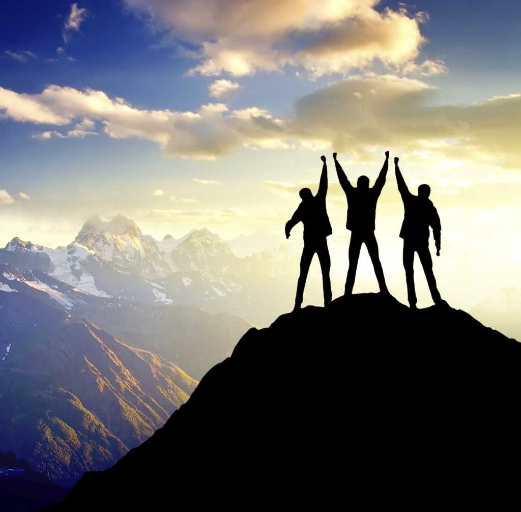 3 champions standing on top of mountain winner triump