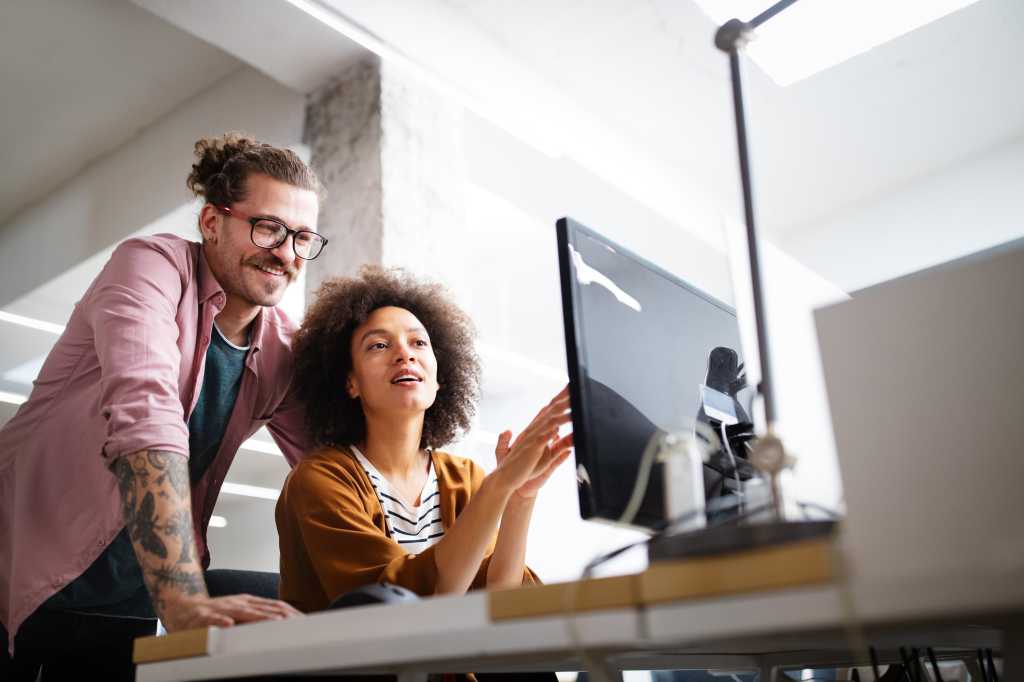 coworkers looking at computer