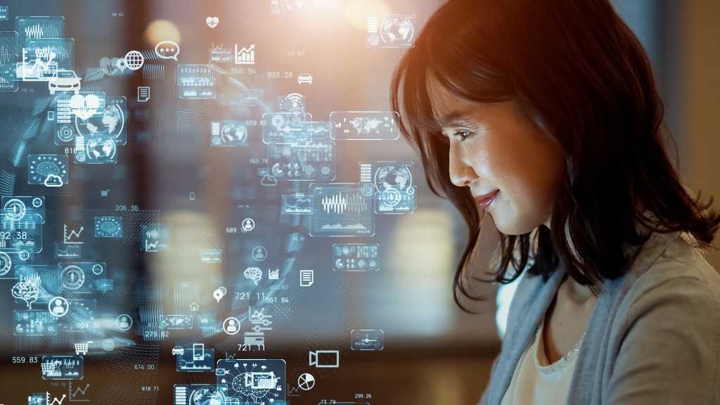 Asian woman watching hologram screens.