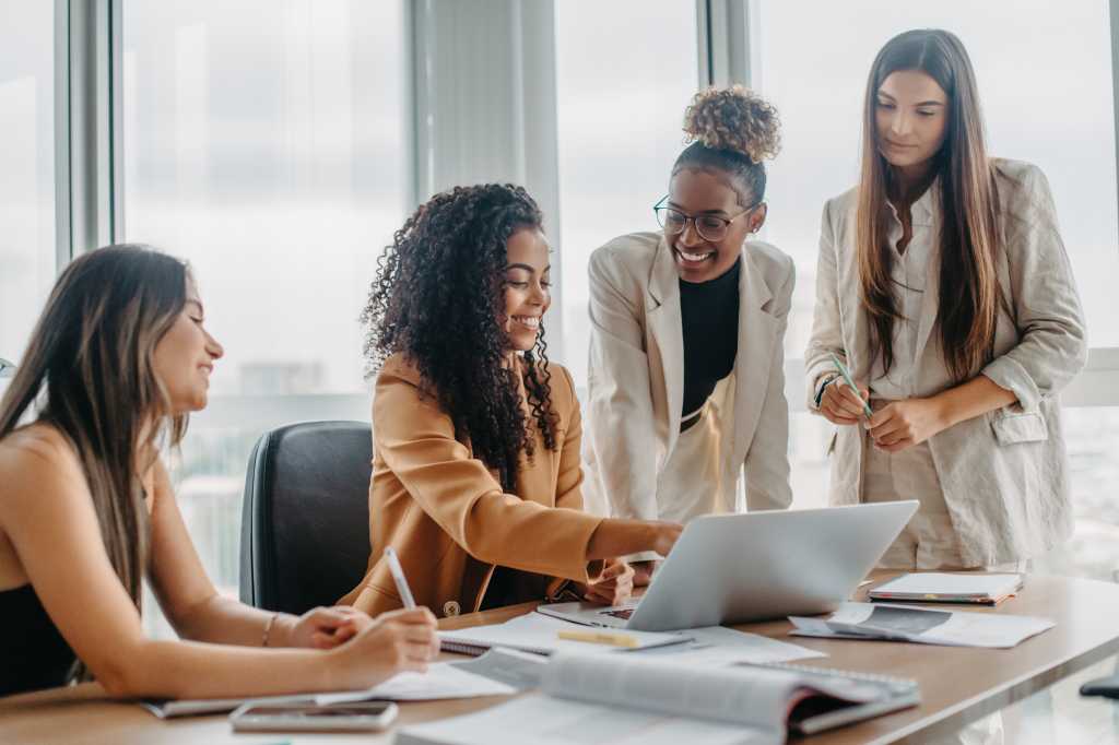 Women engaged in solving problems in an office