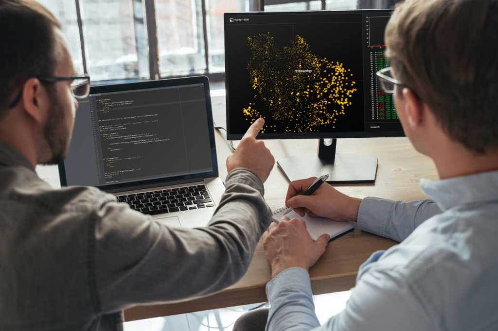 Data science specialists working at office together