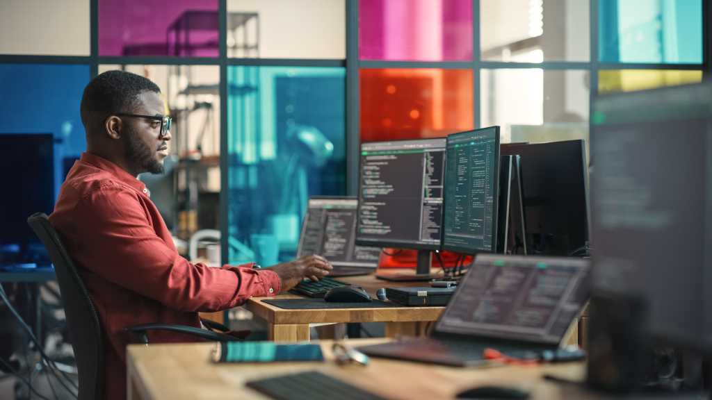 Male Data Scientist Working on Innovative Online Service For Start-up Company.
