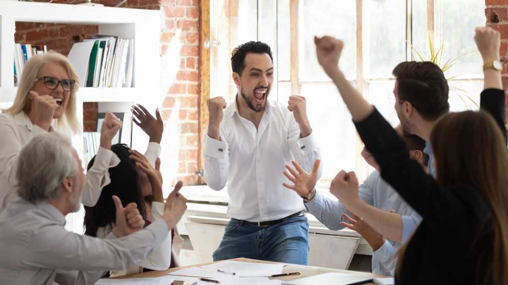 business meeting men women office happy excited success