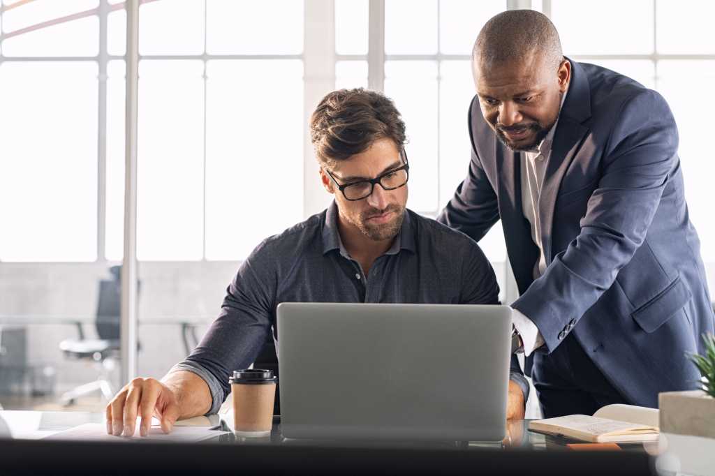 two men talking computer