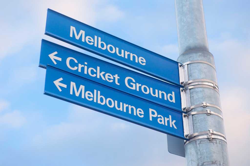 Street sign in Melbourne indicating direction to the cricket groundc