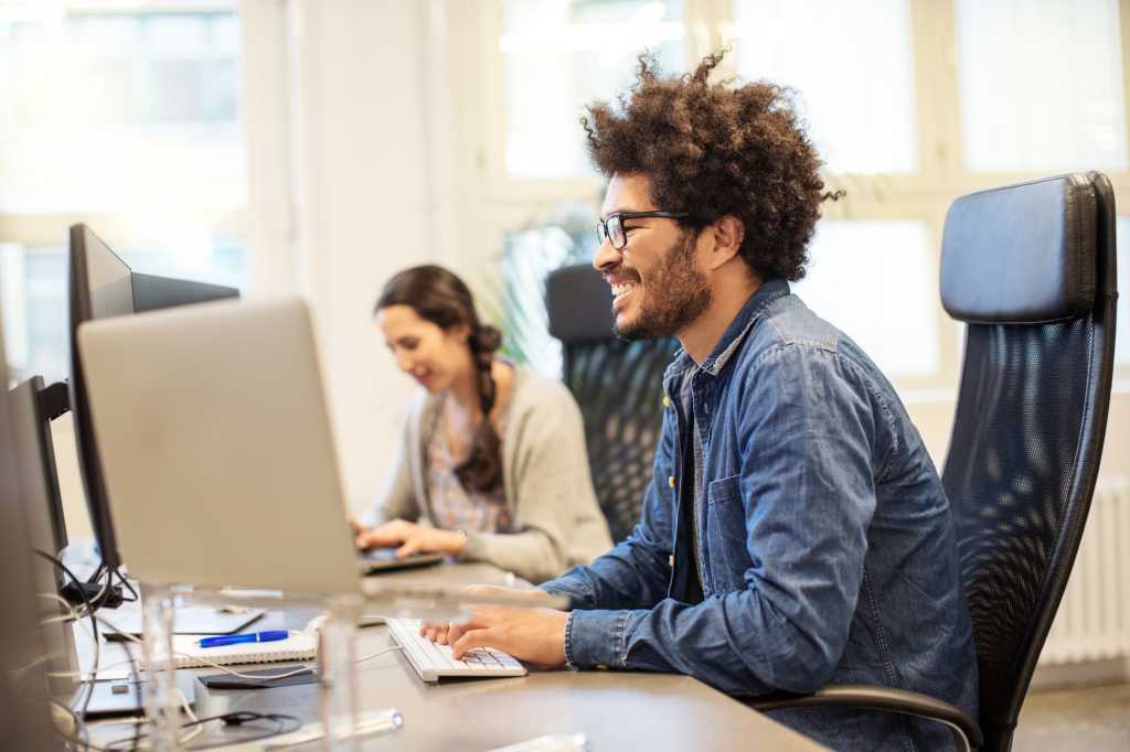 African American man smiling computer