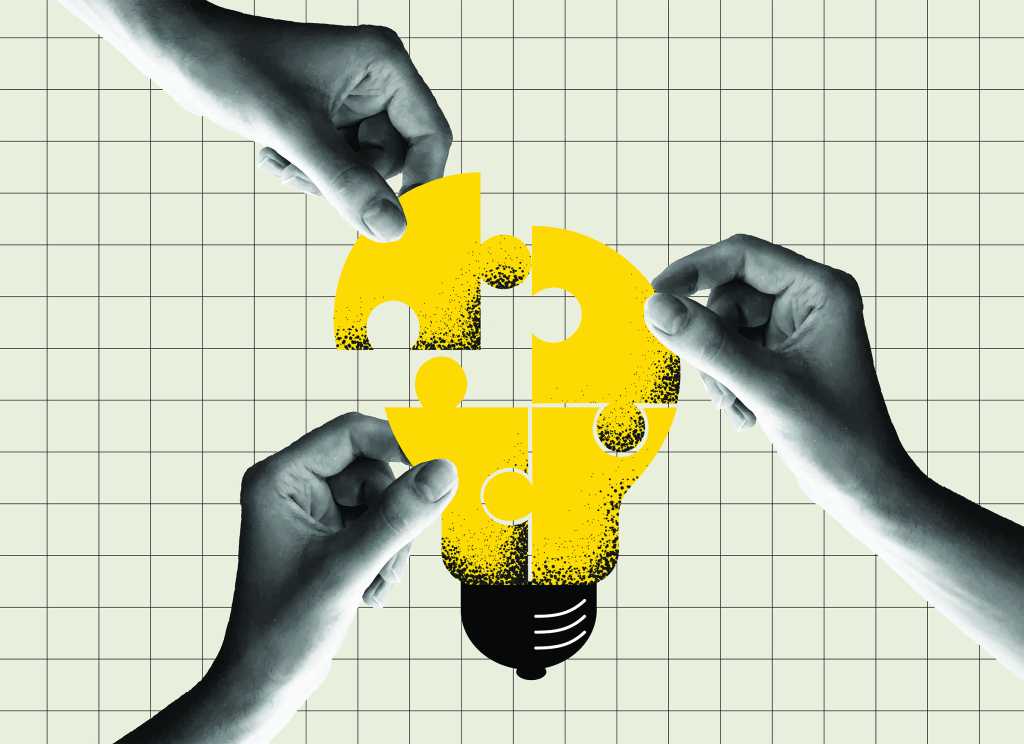 hands assembling puzzle pieces to make lightbulb