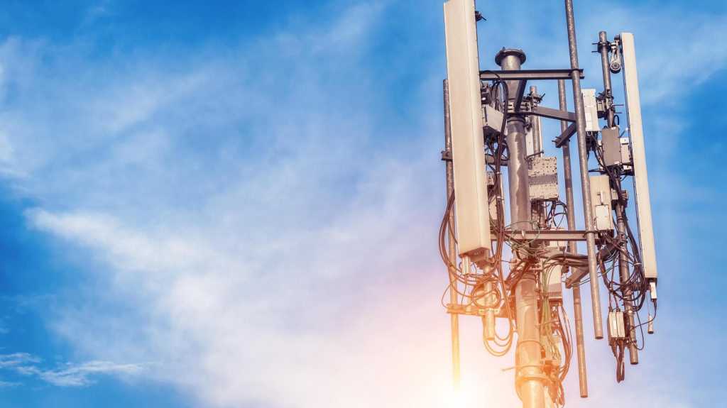 Technology on the top of the telecommunication GSM (5G,4G,3G) tower.Cellular phone antennas on a building roof.Telecommunication mast television antennas.Receiving and transmitting stations