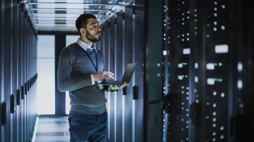 tech troubleshooting in cloud server room