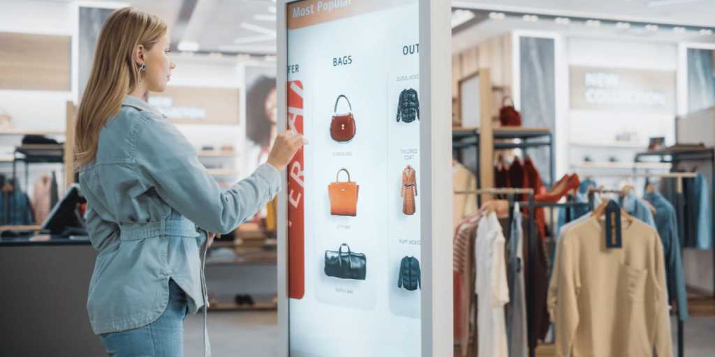 Woman shopping and interacting with a digital touchscreen in store