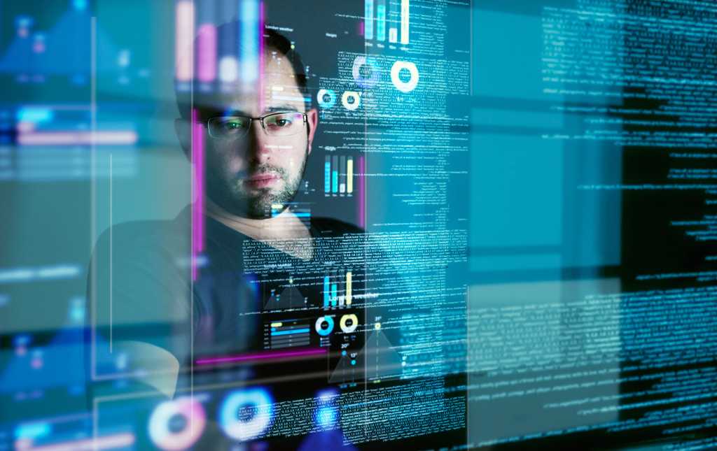 Focus, programming man with hologram, code and futuristic with cyber security, digital software and big data. Male person, cloud computing or employee with concentration, holographic and programmer