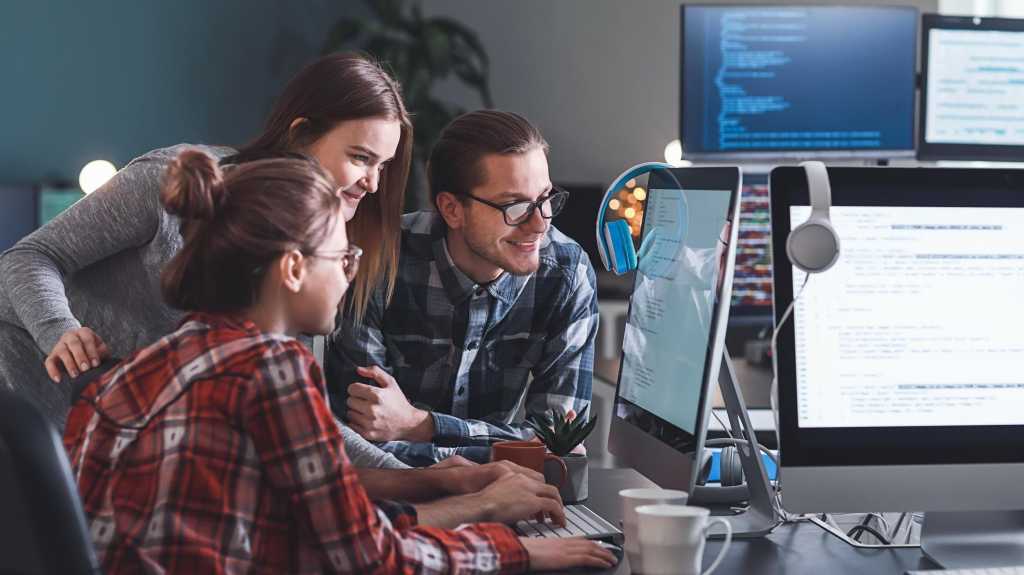 Team of programmers working in office