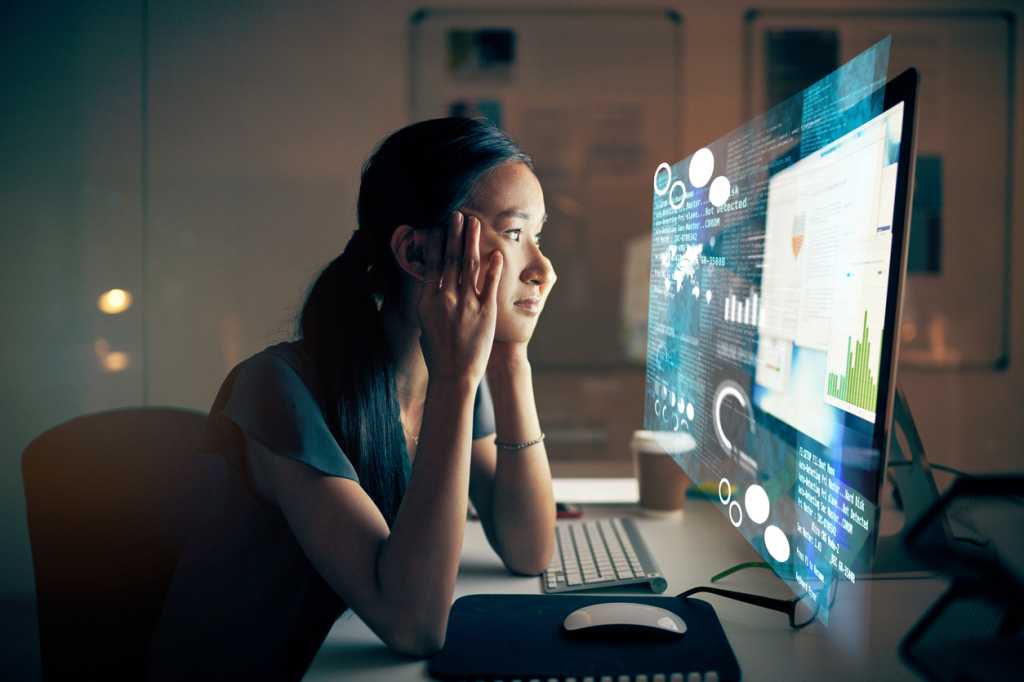 woman looking sadly at computer