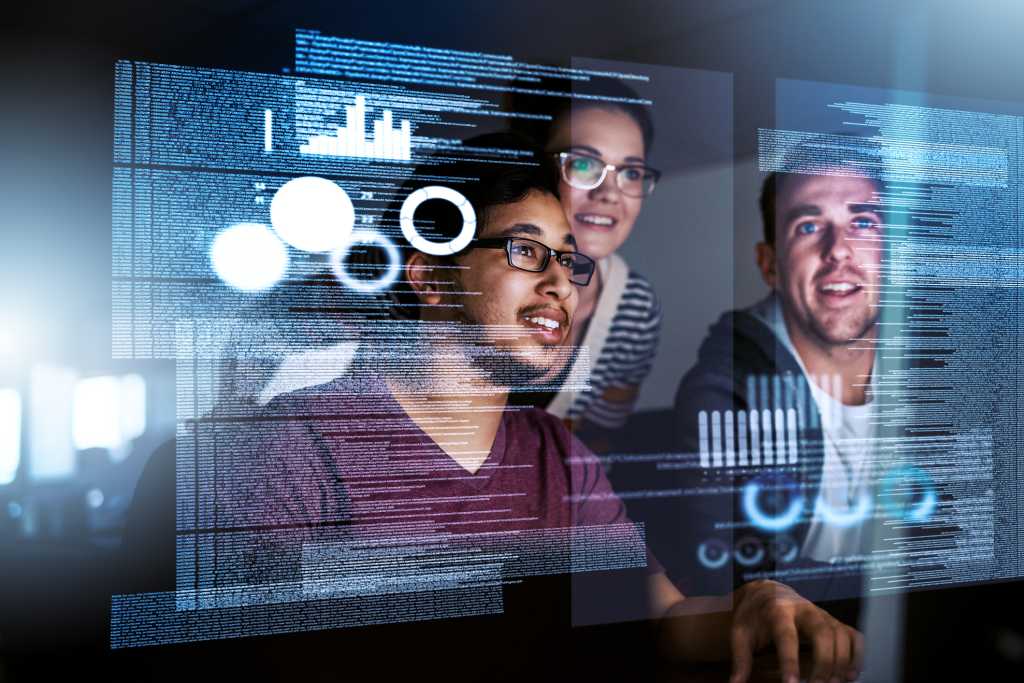 3 coworkers looking at computer screen
