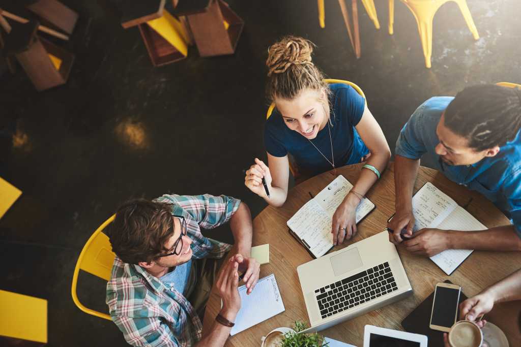 people chatting in office desk