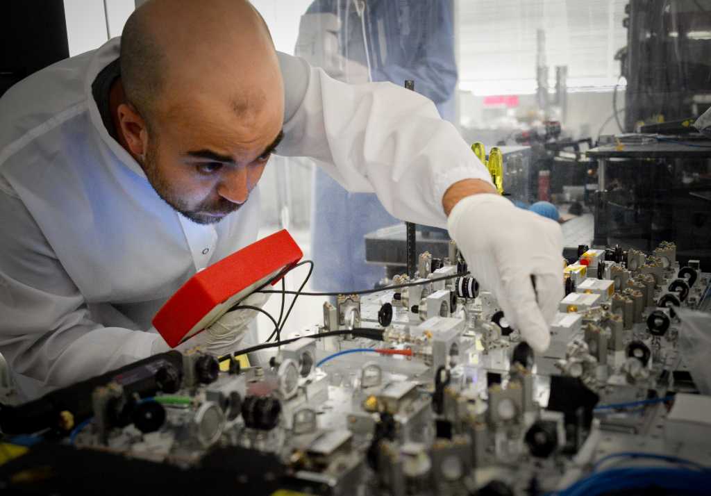 A researcher working on quantum hardware