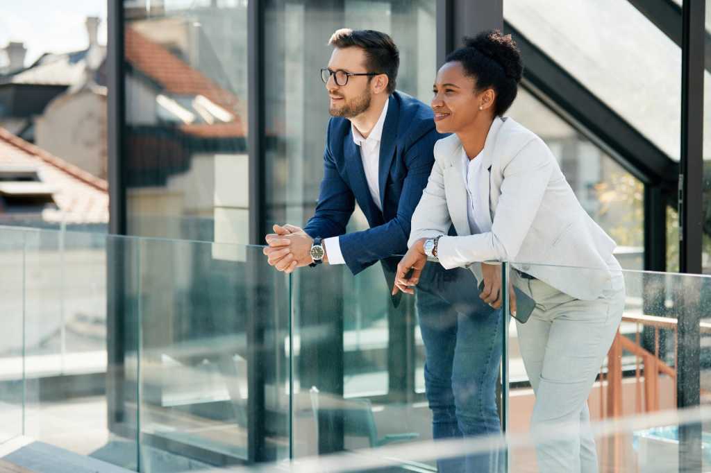 Cloud - Business People looking out from a balcony